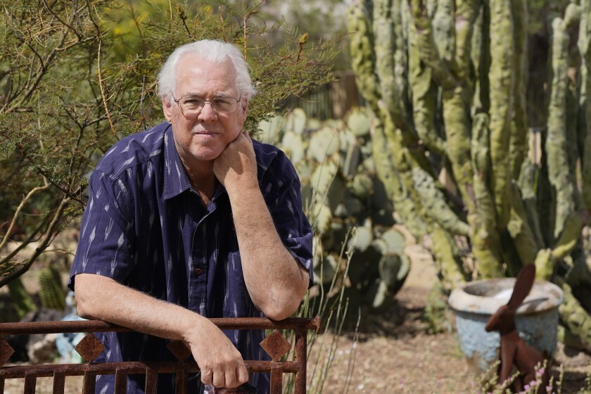 In this April 8, 2021, photo Tom Rawles poses for a photo in Carefree, Ariz. Rawles is an ex-Republican county supervisor in Maricopa County, which includes Phoenix and was critical in Biden carrying swing-state Arizona. After voting for Biden, Rawles registered as a Democrat. (AP Photo/Ross D. Franklin)