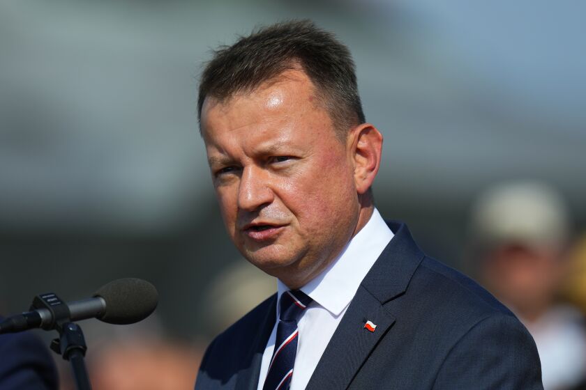 FILE - Defense Minister of Poland Mariusz Blaszczak answers questions to media after signing an air policing treaty at an airshow in Malacky, Slovakia, Aug. 27, 2022. Blaszczak on Tuesday, Dec. 6 says his country will accept a Patriot missile defense system which Germany offered to Poland last month. The German offer was made after an errant missile fell in Poland near the border with Ukraine, killing two Polish men. (AP Photo/Petr David Josek, file)