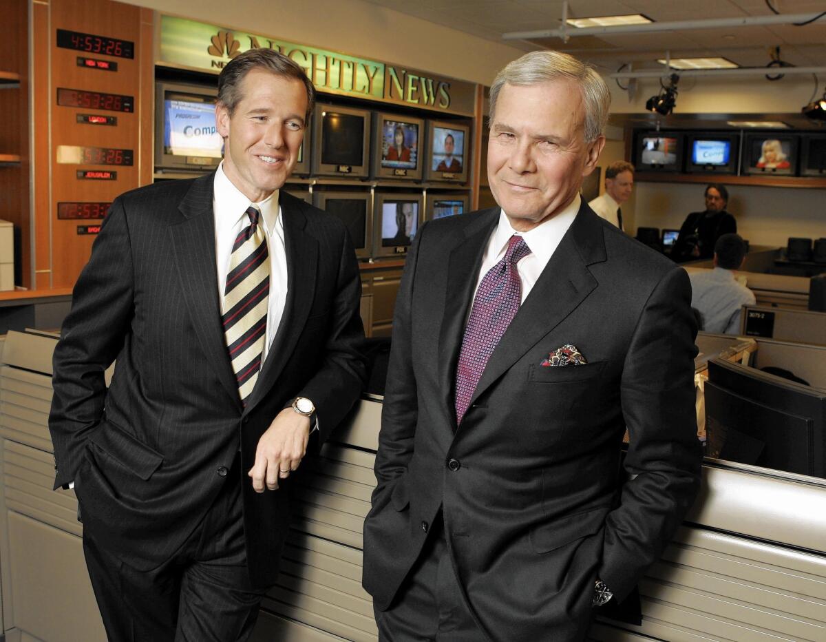 NBC Nightly News anchor Tom Brokaw, right, and his successor Brian Williams, before Brokaw's last broadcast on Dec. 1, 2004.