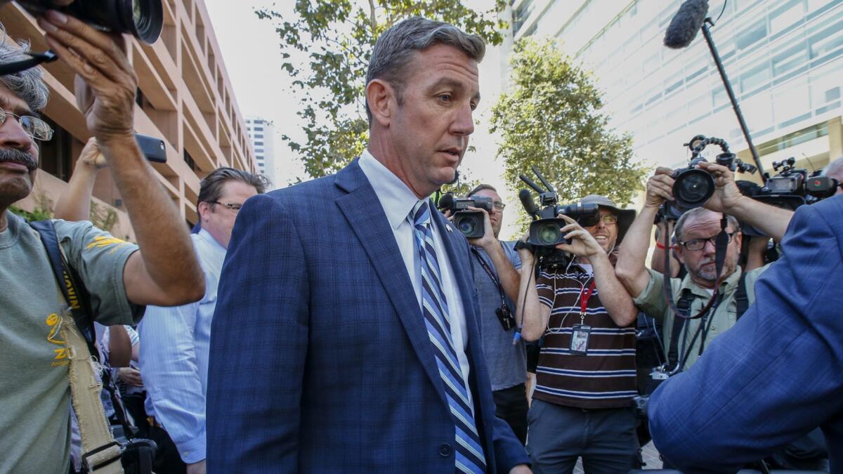 U.S. Rep. Duncan Hunter leaves a federal courthouse in San Diego after pleading not guilty to charges of illegally using his campaign account for personal expenses.