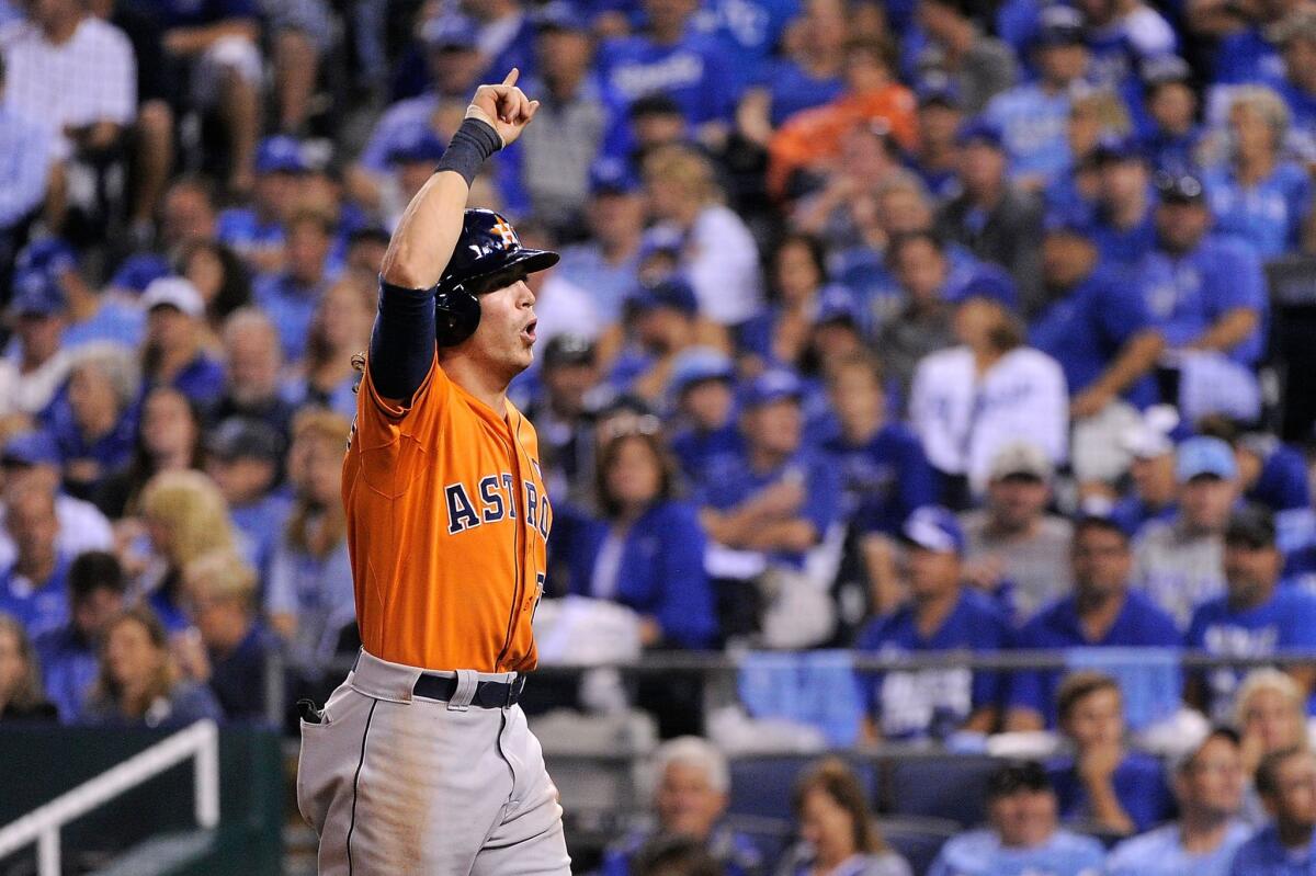 Colby Rasmus of the Houston Astros celebrates after hitting a solo home run in the eighth inning against the Kansas City Royals during Game 1 of the American League division series.