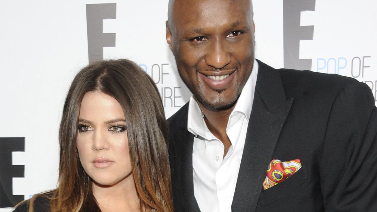 Khloe Kardashian and Lamar Odom, from the show "Keeping Up With the Kardashians," attend an E! Network upfront event in 2012 at Gotham Hall in New York.