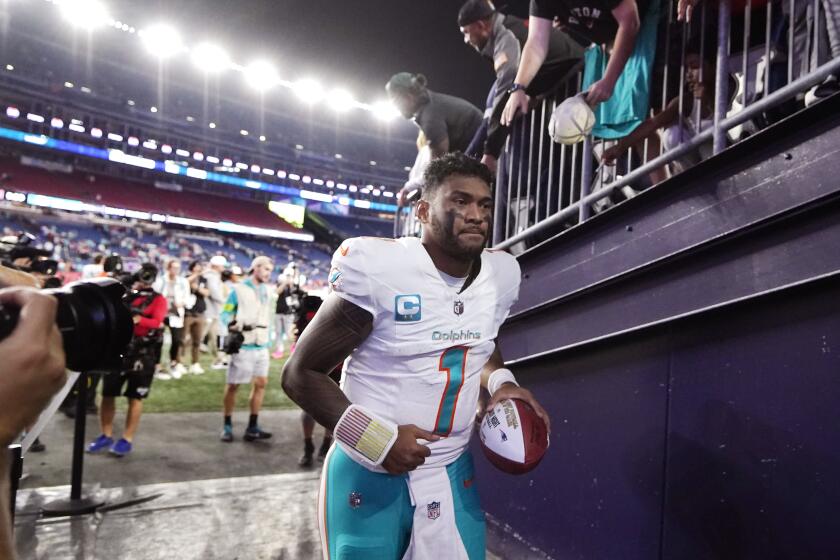 Miami Dolphins quarterback Tua Tagovailoa jogs off the field after defeating the New England Patriots 24-17 following an NFL football game, Sunday, Sept. 17, 2023, in Foxborough, Mass. (AP Photo/Steven Senne)