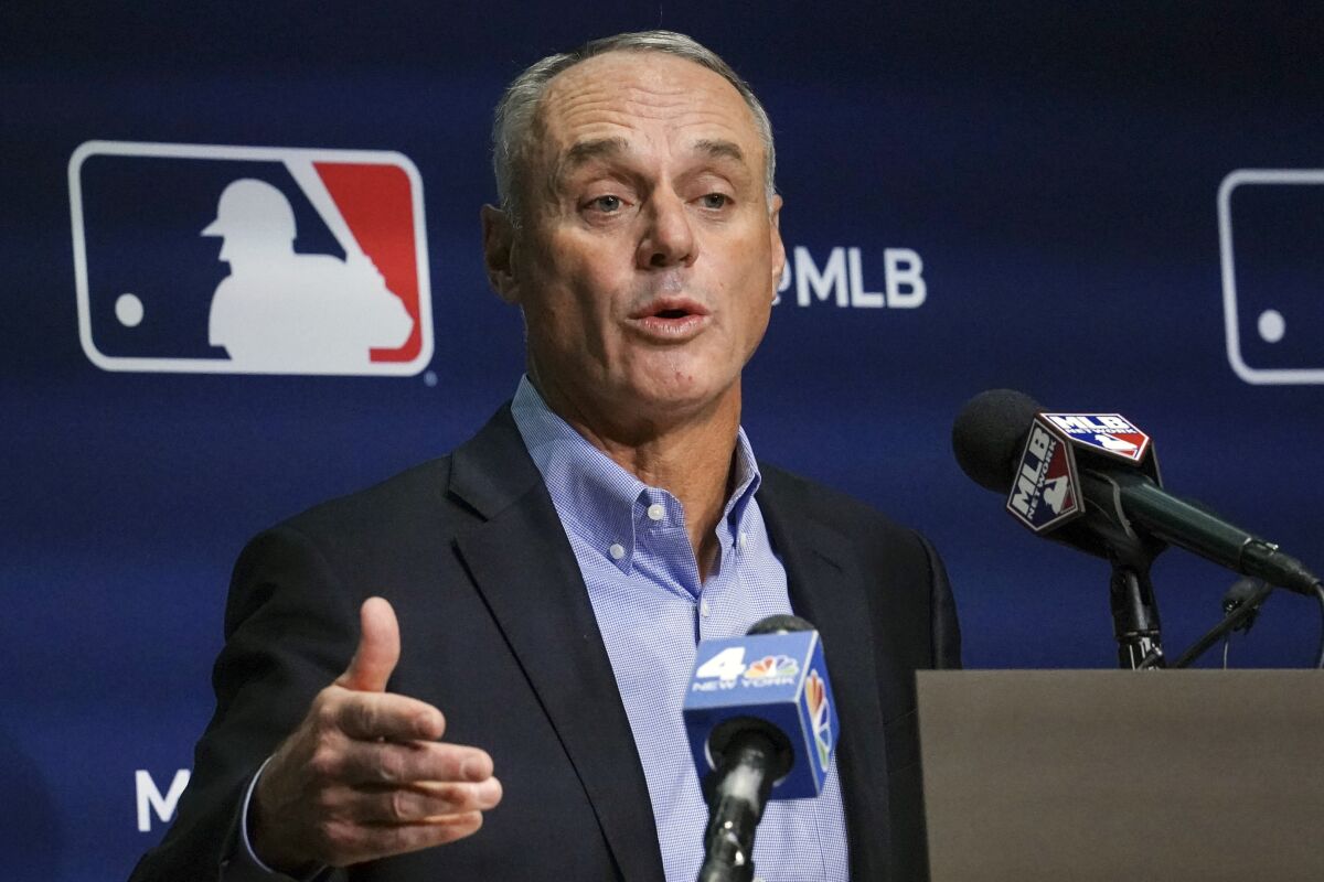 FILE -Major League Baseball commissioner Rob Manfred speaks during a news conference, Thursday March 10, 2022, in New York. About 1 in 4 fans of Major League Baseball feel at least some anger toward the sport after its first work stoppage in a generation, according to a new poll, but the vast majority are still excited about the new season. Only 27% of Americans say they are currently a fan of MLB, according to the poll from The Associated Press-NORC Center for Public Affairs Research. Baseball Commissioner Rob Manfred apologized to fans when the labor agreement was reached on March 10. (AP Photo/Bebeto Matthews, File)