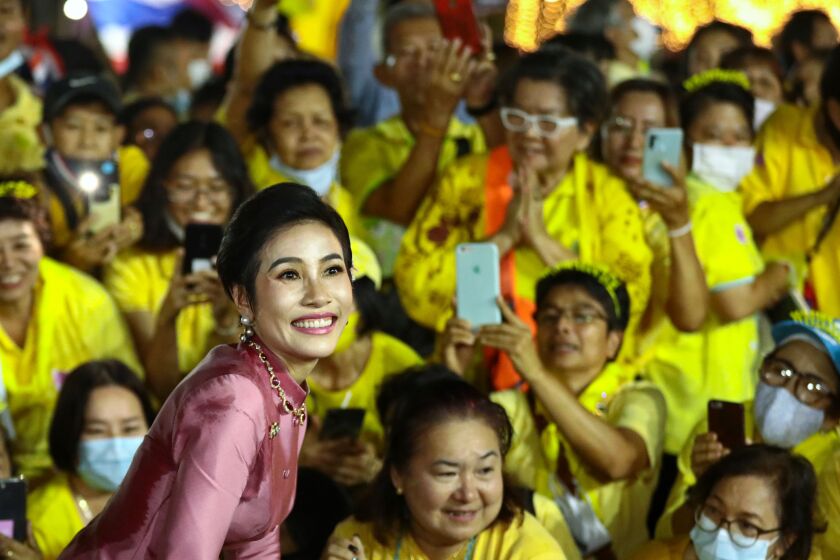 Royal noble consort Sineenat Bilaskalayani, also known as Sineenat Wongvajirapakdi, smiles while greeting royalist supporters outside the Grand Palace in Bangkok on November 1, 2020 after a religious ceremony at a Buddhist temple inside the palace. (Photo by Jack TAYLOR / AFP) (Photo by JACK TAYLOR/AFP via Getty Images)