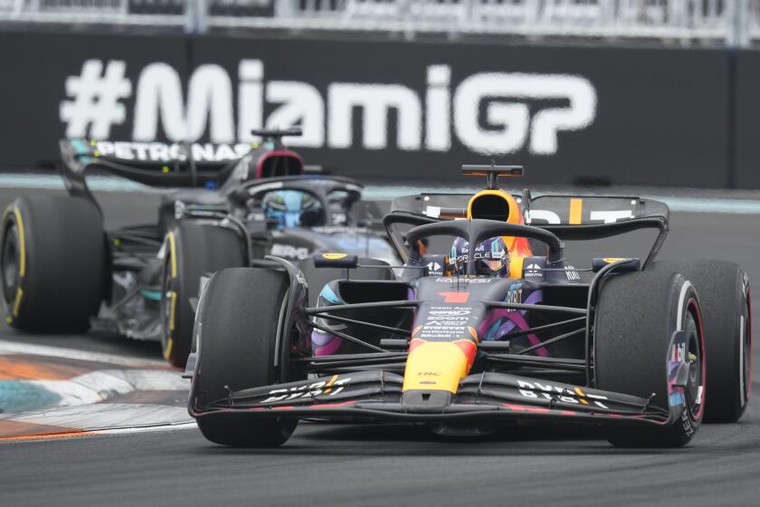 Red Bull driver Max Verstappen battles Mercedes driver George Russell (63) during the Formula One Miami Grand Prix.