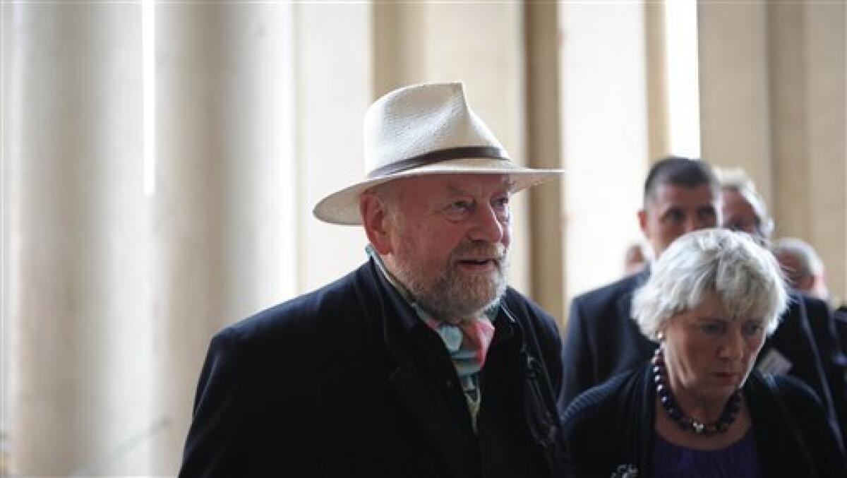 Danish cartoonist Kurt Westergaard, who sparked Muslim anger with drawings of the Prophet Mohammed, and his wife Gitte, right, arrive for the awarding ceremony of the M100 media prize 2010 in Potsdam near Berlin, eastern Germany, Wednesday, Sept 8, 2010. Westergaard drew the most controversial of 12 caricatures of the Prophet Mohammed, first published in a Danish newspaper in 2005, which many Muslims considered offensive. (AP Photo/Johannes Eisele, pool)