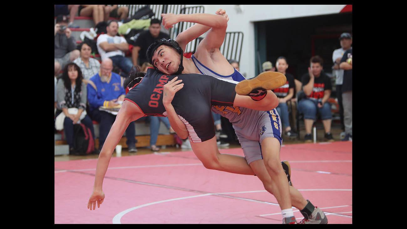 Fountain Valley High School wrestler Thanh Tu takes down Lakewoodâ€™s Elijah Ocampo in the CIF Southern Section Dual Meet Wrestling Championships, Division 3, 132 lb. match, in Lakewood on Saturday, May 26, 2019.