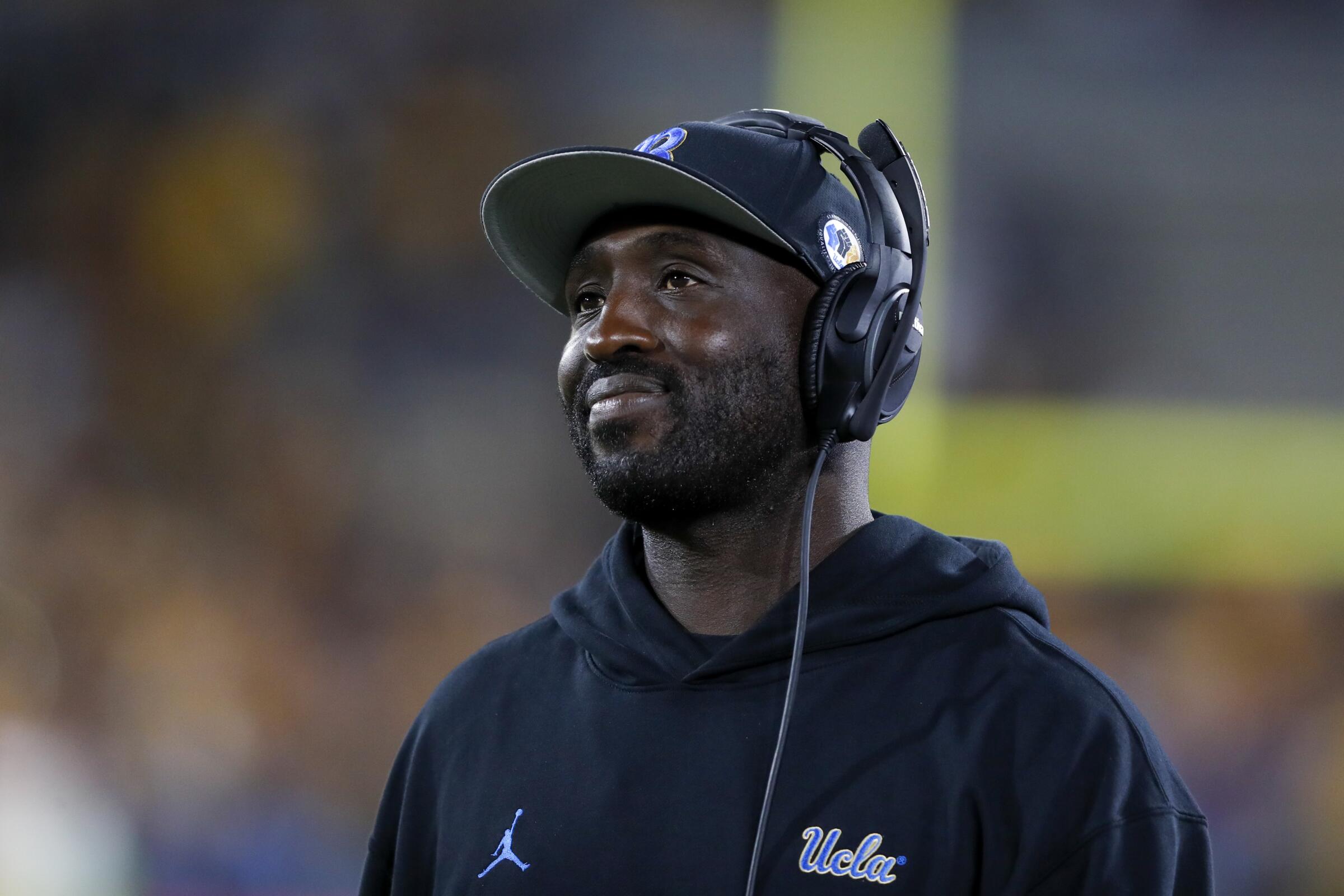 UCLA running backs coach DeShaun Foster on the sideline during a football game against Arizona State.