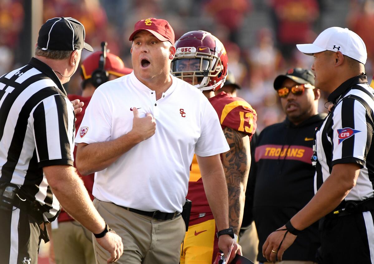 USC coach Clay Helton argues with officials Saturday during the game at the Rose Bowl.
