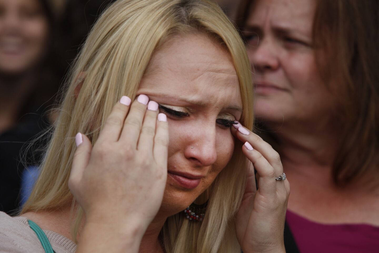 Jessica Besch cries while she talks about her mother, Susan Mellen, shortly after a judge voided Mellen's conviction in a 1997 murder.