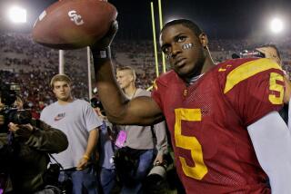 USC running back Reggie Bush walks off the field after the Trojans defeated Fresno State on Nov. 19, 2005.