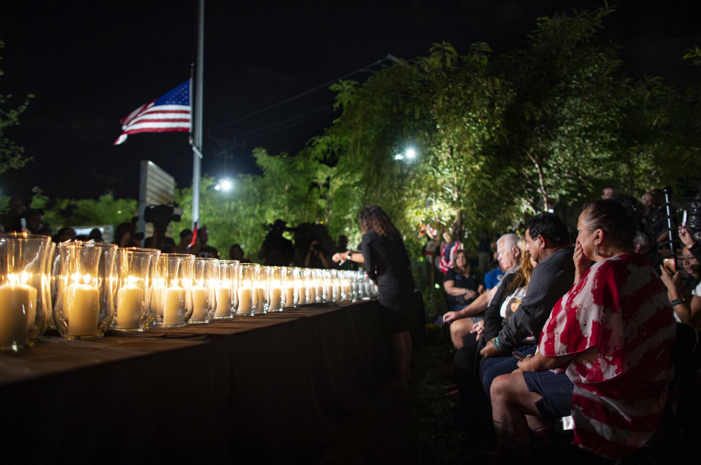 Family members grieve as the 58 victims' names are read aloud and candles are lit Oct. 1 on the one-year anniversary of the mass shooting in Las Vegas, Nevada.
