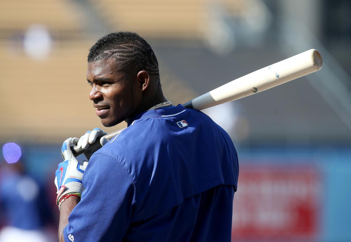 Dodgers right fielder Yasiel Puig takes batting practice before a game against the Angels on May 17.