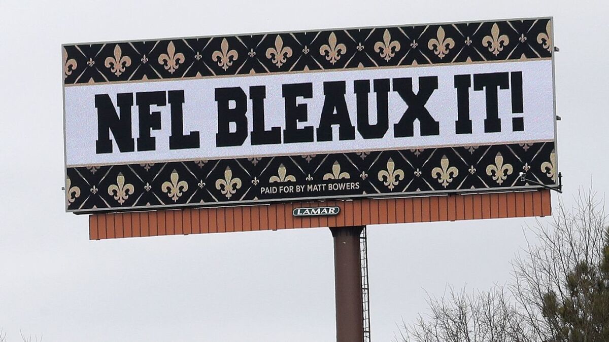 A billboard beside Interstate 75 in Atlanta protests a controversial call in the NFC championship game between the Rams and the New Orleans Saints.