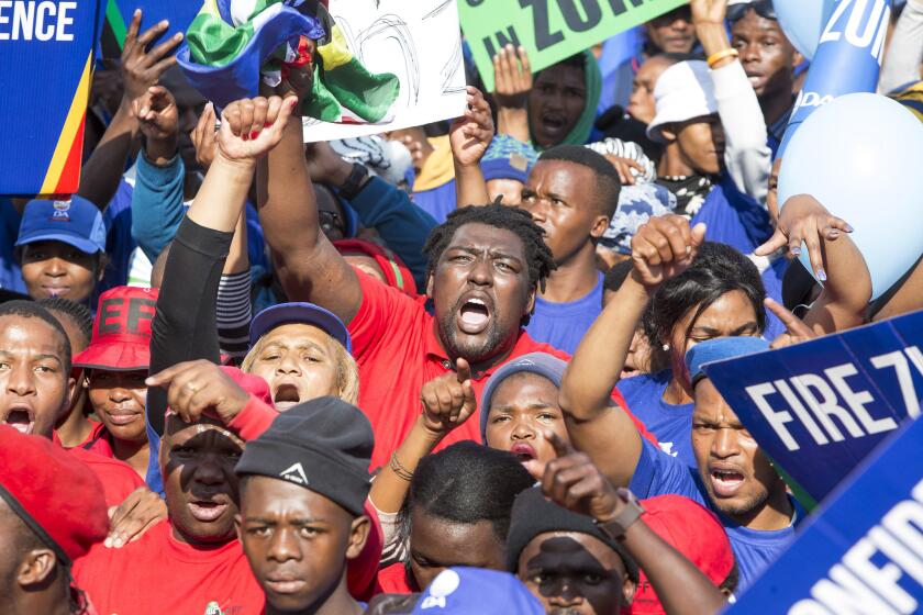 Protesters against President Jacob Zuma march to parliament in Cape Town, South Africa on Tuesday.