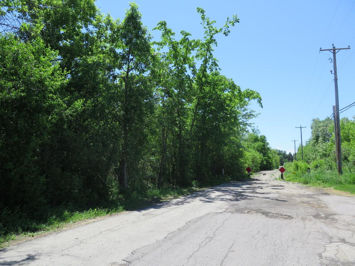 The site in Waukesha, Wis., where a bicyclist found a 12-year-old girl who had 19 stab wounds.