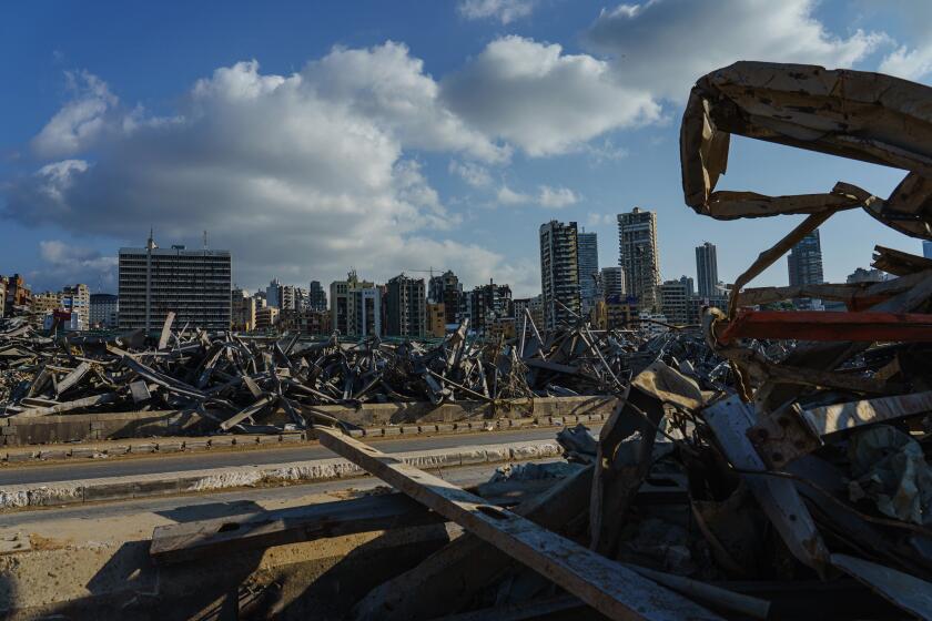 BEIRUT, LEBANON -- SEPTEMBER 26, 2020: Piles of debris and destroyed buildings could still be seen at the Port of Beirut in Lebanon, Saturday Sept. 26, 2020. On Aug. 4, a stockpile of 2,755 tons of ammonium nitrate N a fertilizer that turns explosive when mixed with accelerants N detonated inside the port, killing nearly 200 people, injuring thousands and leaving hundreds of thousands without a home. (Marcus Yam / Los Angeles Times)