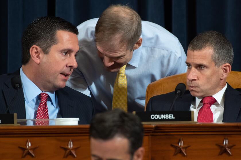 Ranking Member Devin Nunes (L), Republican of California, speaks with Representative Jim Jordan (C), Republican of Ohio, and Republican Counsel Stephen Castor (R), during the first public hearings held by the House Permanent Select Committee on Intelligence as part of the impeachment inquiry into US President Donald Trump, with witnesses Ukrainian Ambassador William Taylor and Deputy Assistant Secretary George Kent testifying, on Capitol Hill in Washington, DC, November 13, 2019. - Donald Trump faces the most perilous challenge of his three-year presidency as public hearings convened as part of the impeachment probe against him open under the glare of television cameras on Wednesday. (Photo by SAUL LOEB / POOL / AFP) (Photo by SAUL LOEB/POOL/AFP via Getty Images) ** OUTS - ELSENT, FPG, CM - OUTS * NM, PH, VA if sourced by CT, LA or MoD **