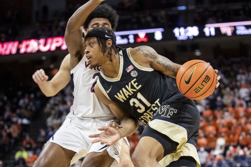 Wake Forest's Alondes Williams (31) drives during the first half of an NCAA college basketball game against Virginia in Charlottesville, Va., Sat, Jan. 15, 2022. (AP Photo/Erin Edgerton)