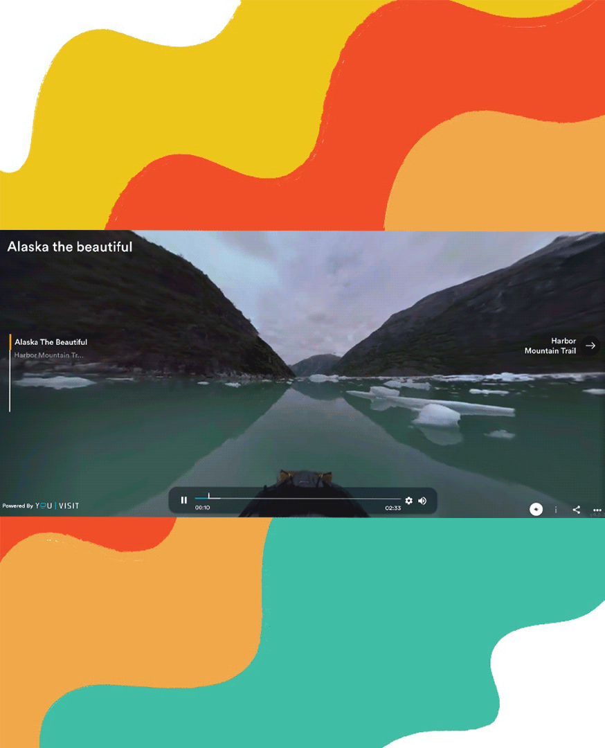 video of boat touring through a lake in southeast Alaska with rainbow background