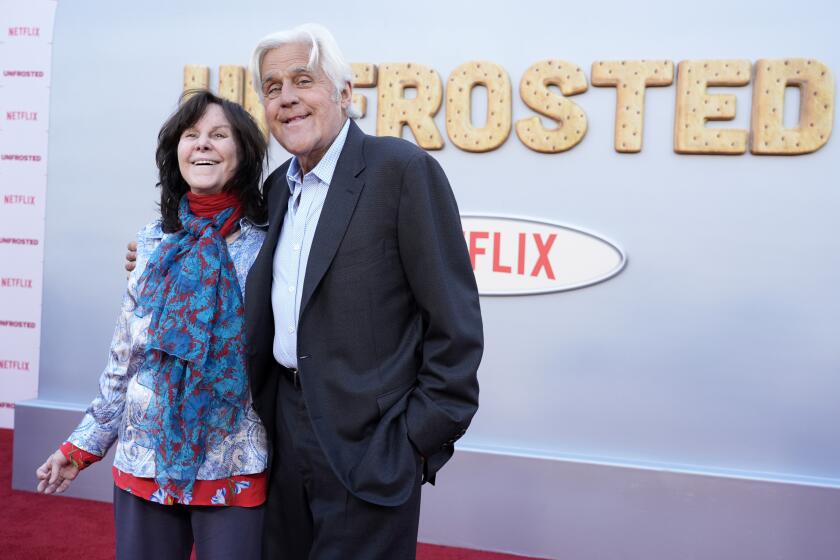 Jay Leno, right, and his wife Mavis smile at the premiere of the film "Unfrosted" at the Egyptian Theatre in Los Angeles