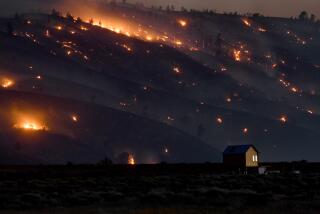 A house sits alone as the Lake Fire creeps its way up the hill towards Palmdale Friday. (Wally Skalij/Los Angeles Times)