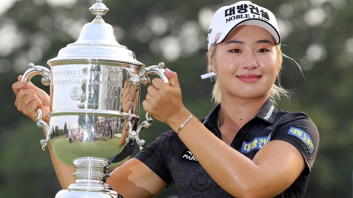 Jeongeun Lee6 poses with the U.S. Women's Open winner's trophy Sunday at the Country Club of Charleston.