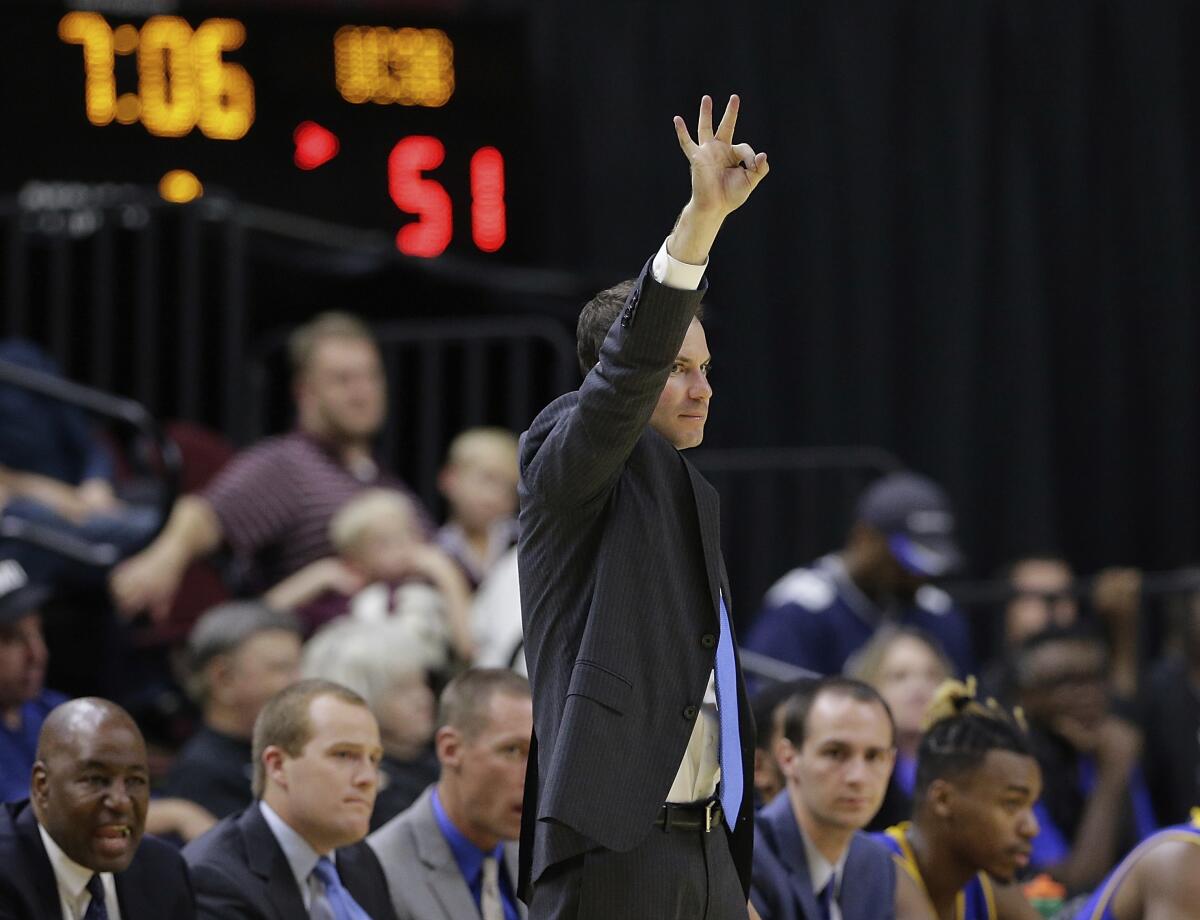 UC Santa Barbara head coach Joe Pasternack signals during a game.