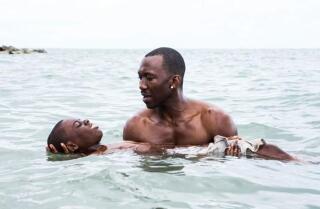 Alex Hibbert and Mahershala Ali in the movie "Moonlight."