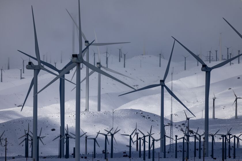MOJAVE, CA - FEBRUARY 26: Wind turbines in the southern Sierra Nevada Mountains foothills are surrounded by fresh snow at unusually low elevations brought by a powerful storm on February 26, 2023 near Mojave, California. The break from low snow and heavy rain today will be short-lived with more in the forecast. (Photo by David McNew/Getty Images)