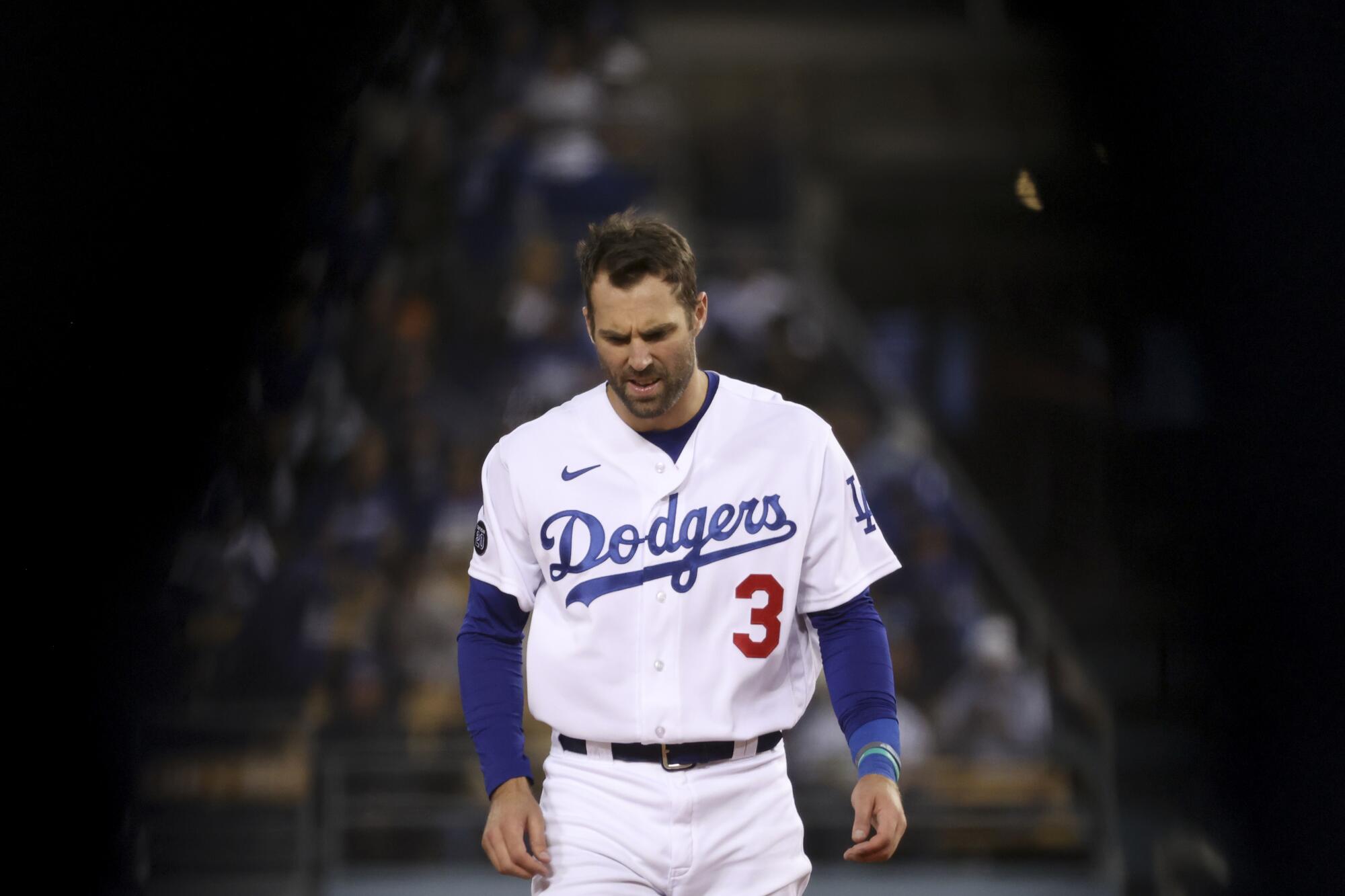 Los Angeles Dodgers' Chris Taylor reacts after a hitting a fly ball for an out