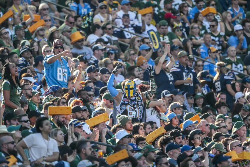 CARSON, CA, SUNDAY, NOVEMBER 3, 2019 - Chargers fans celebrate even though they are clearly outnumbered by Packers fans at Dignity Health Sports Park. (Robert Gauthier/Los Angeles Times)