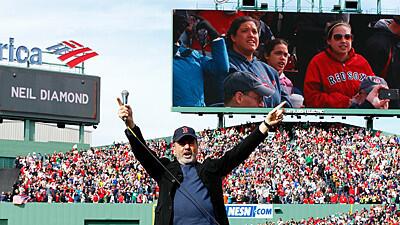 Neil Diamond sings "Sweet Caroline" during a game between the Kansas City Royals and Boston Red Sox in the 8th inning at Fenway Park.