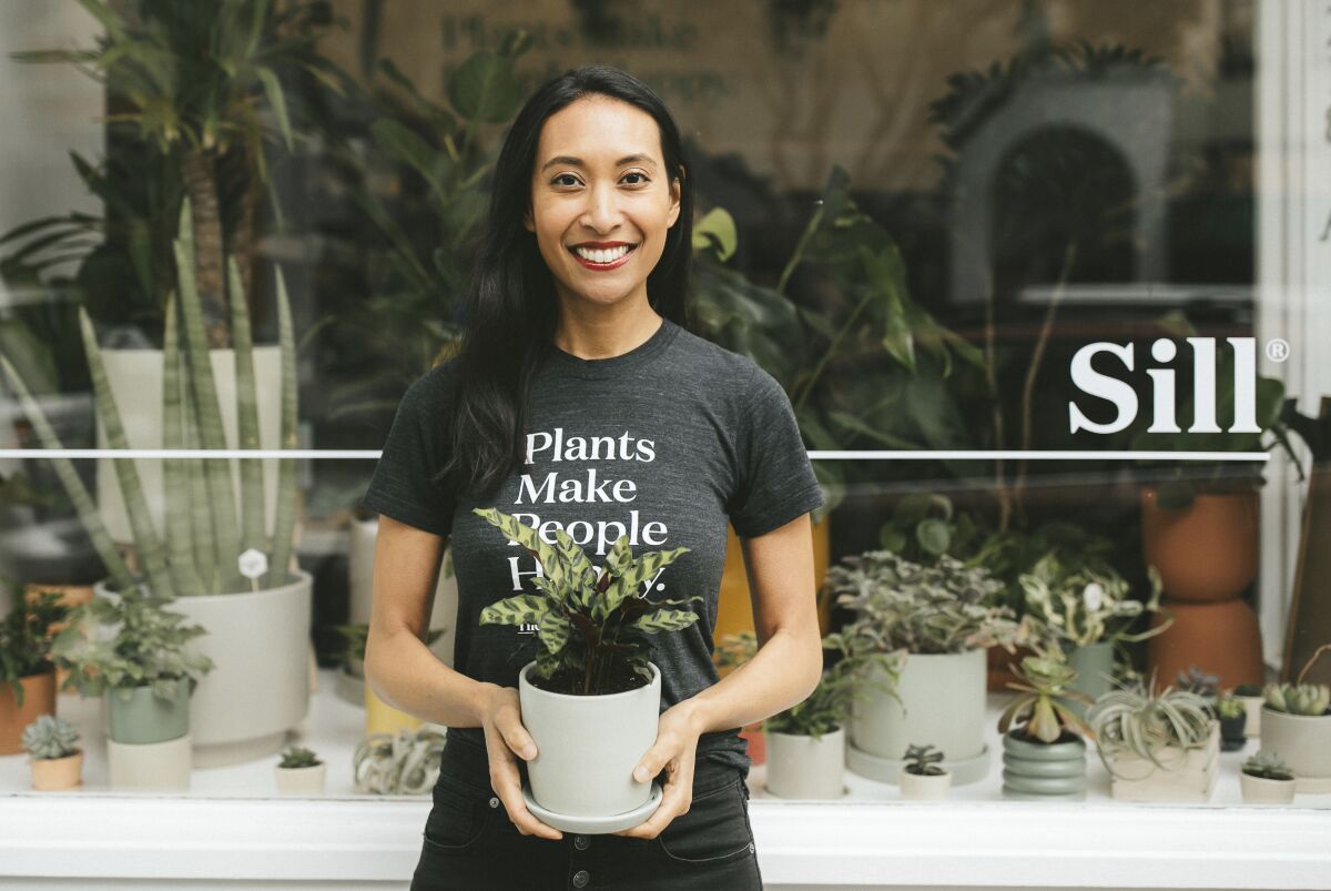 This May 30, 2019 photo provided by The Sill shows Eliza Blank outside The Sill's San Francisco shop. Blank, who founded The Sill in 2012, says people turned to plants when they realized they would be stuck at home due to COVID-19 concerns and isolated from others for much longer than expected. (Kelly Boitano/The Sill via AP