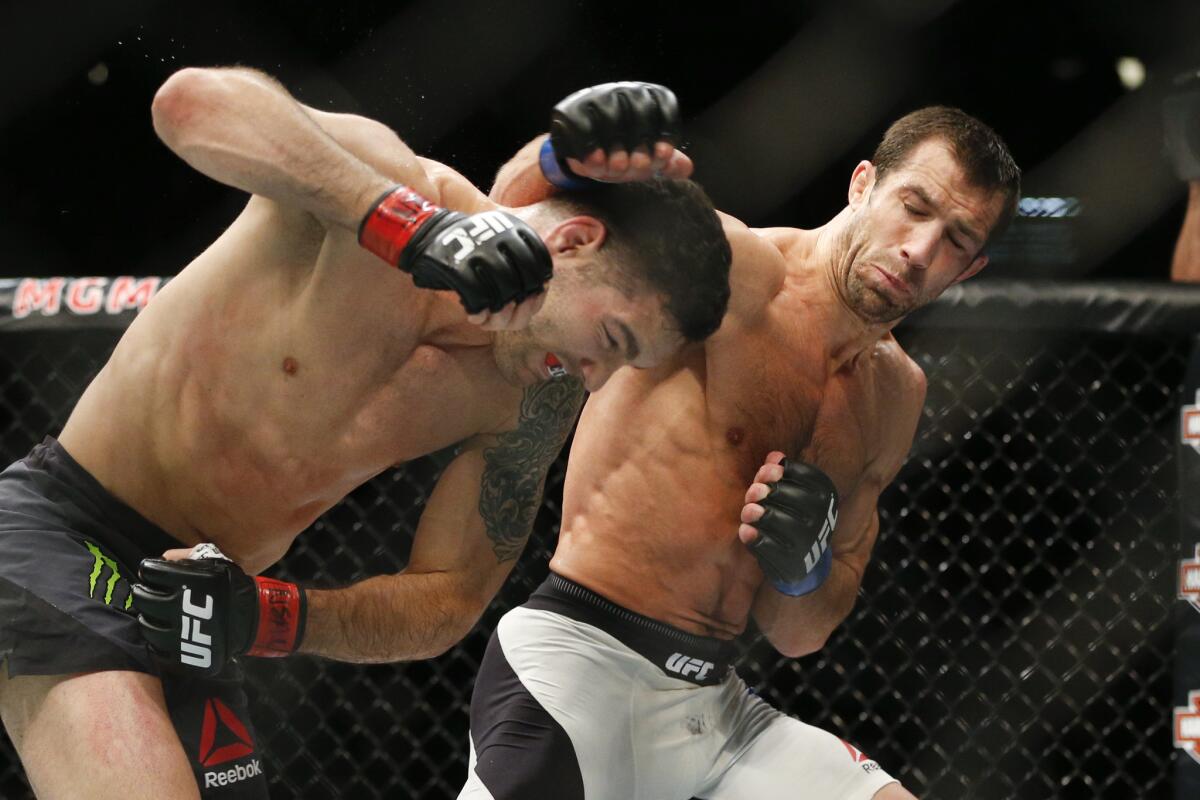 Chris Weidman, left, fights Luke Rockhold for the middleweight championship at UFC 194, on Dec. 12.