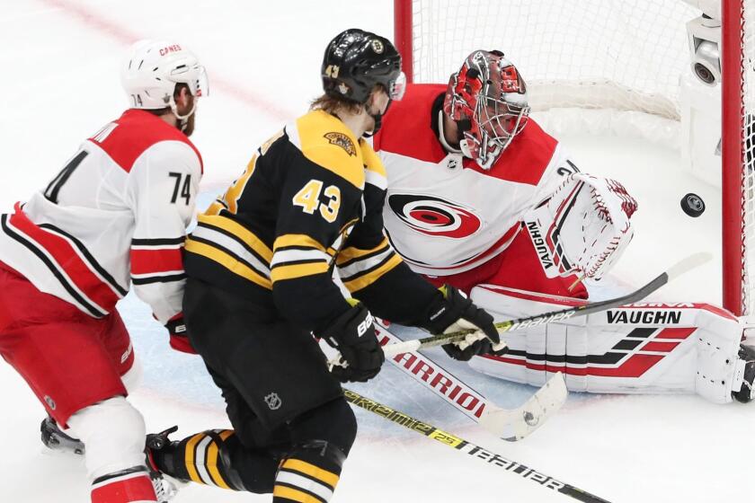 BOSTON, MASSACHUSETTS - MAY 12: Danton Heinen #43 of the Boston Bruins scores a third period goal against Petr Mrazek #34 of the Carolina Hurricanes in Game Two of the Eastern Conference Final during the 2019 NHL Stanley Cup Playoffs at TD Garden on May 12, 2019 in Boston, Massachusetts. (Photo by Adam Glanzman/Getty Images) ** OUTS - ELSENT, FPG, CM - OUTS * NM, PH, VA if sourced by CT, LA or MoD **