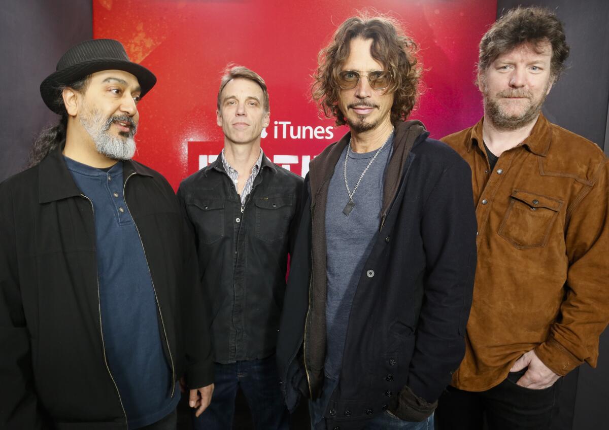 Soundgarden members Kim Thayil, left, Matt Cameron, Chris Cornell and Ben Shepherd stand together for a photo