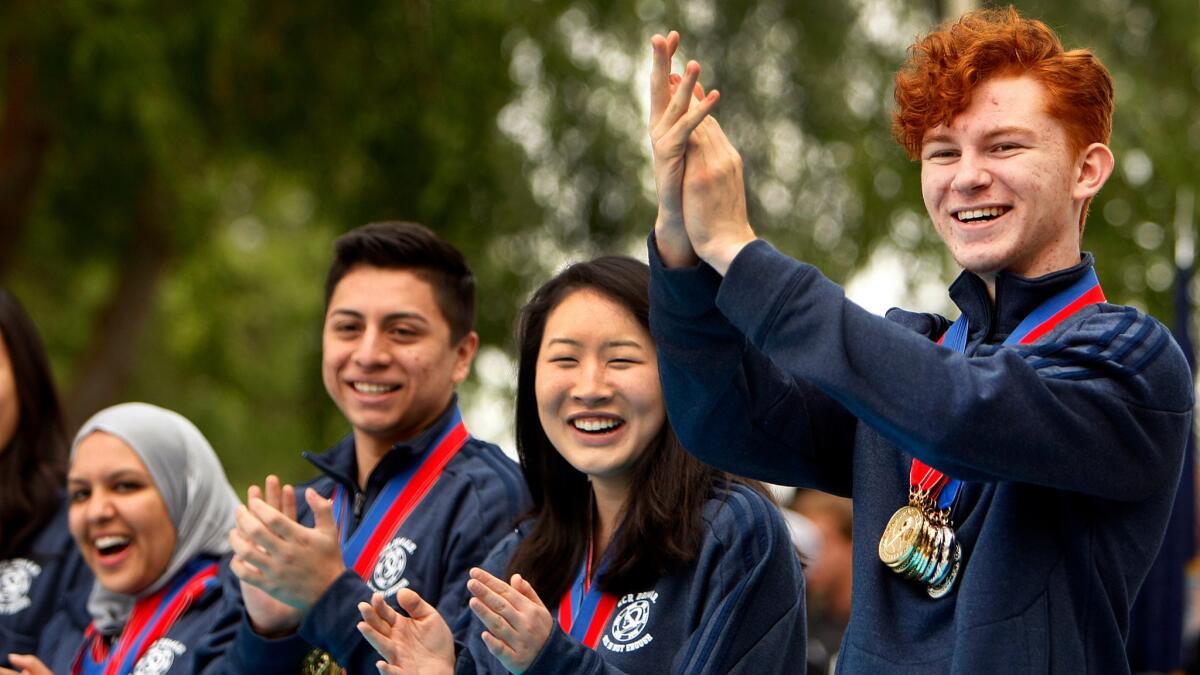 The team from El Camino Real Charter High School celebrates on its way to winning the 2014 national Academic Decathlon. The school was regarded as well run before and after becoming a charter, but faces controversies over health benefits and spending.