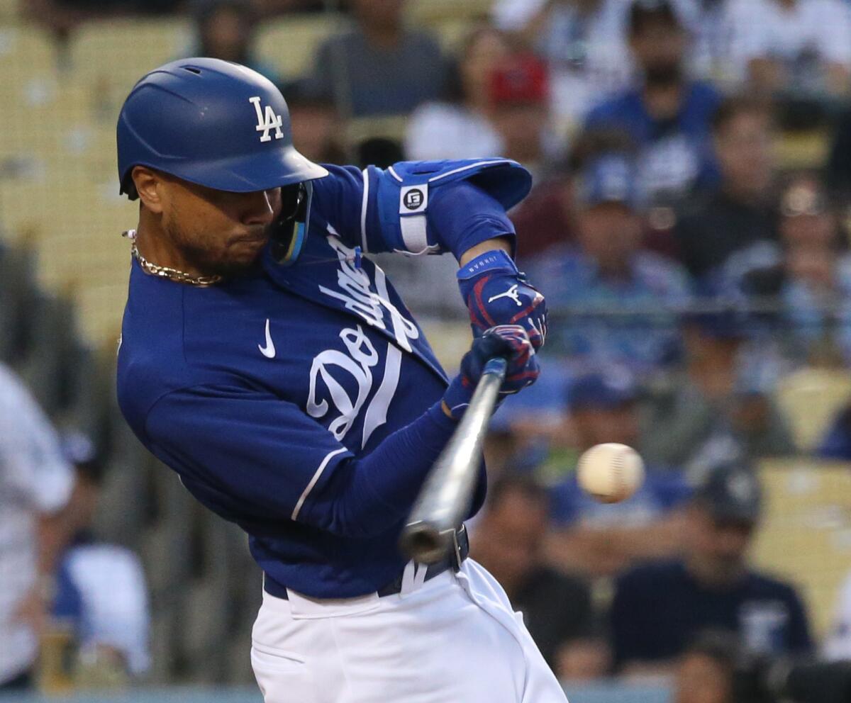 Dodgers' Mookie Betts gets on base with a single.