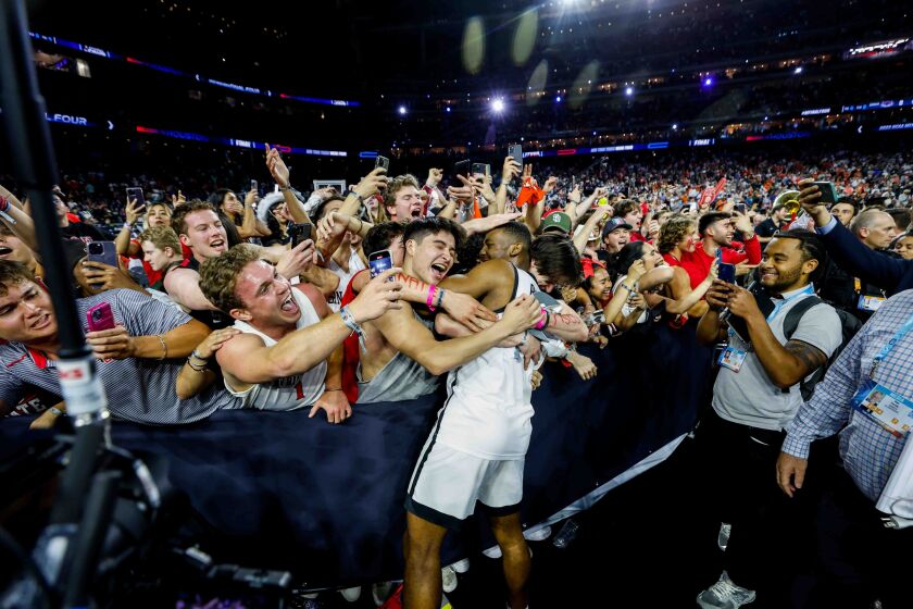 Houston, TX - April 1: San Diego State Aztecs guard Lamont Butler reacts to hitting the game-winning shot at the buzzer to head to the national championship during the semifinal round of the 2023 NCAA Men's Basketball Tournament played between the San Diego State Aztecs and the Florida Atlantic Owls at NRG Stadium on Saturday, April 1, 2023 in Houston, TX. (Meg McLaughlin / The San Diego Union-Tribune)