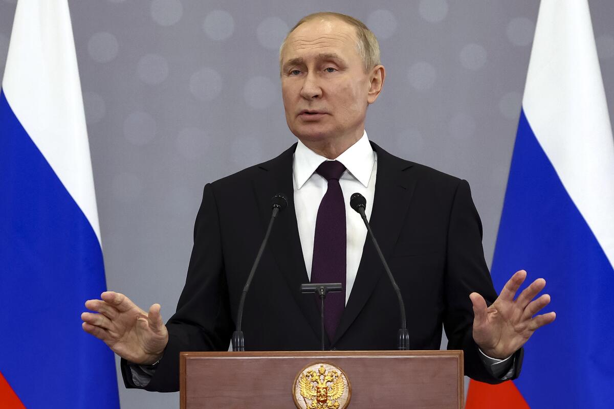 Russian President Vladimir Putin gestures as he speaks to the media after the Summit of leaders from the Commonwealth of Independent States (CIS), in Astana, Kazakhstan, Friday, Oct. 14, 2022. (Valery Sharifulin, Sputnik, Kremlin Pool Photo via AP)