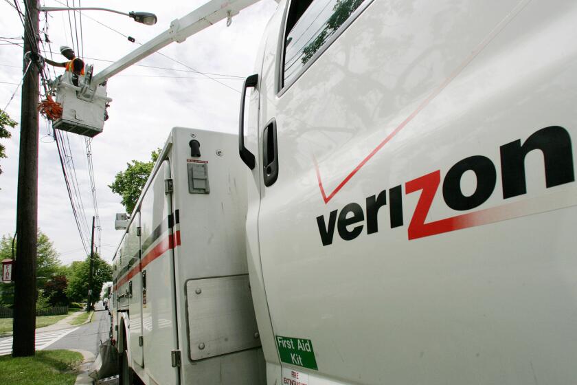 A Verizon technician installs fiber-optic lines in Somerville, N.J., in 2009.