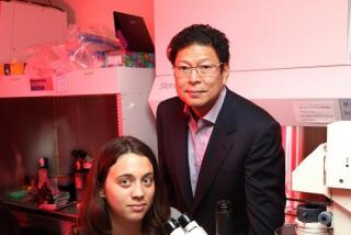 Dr. Jerold Chun, has found that brain cells in people with Alzheimer's disease have different DNA compositions. Here he stands next to Gwen Kaeser, a graduate student and co-first author of a new study on this discovery.
