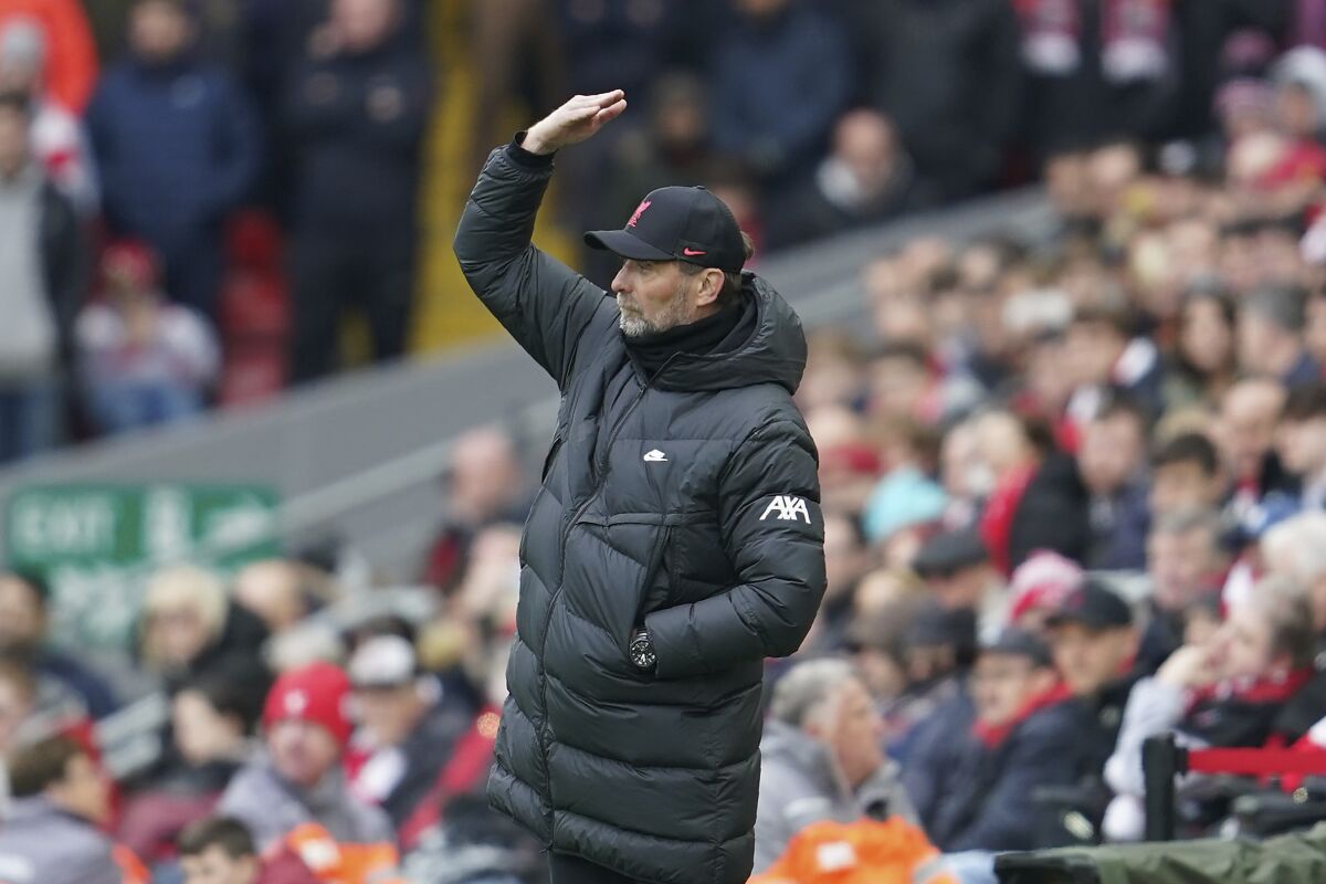 Liverpool's manager Jurgen Klopp gives instructions during the English Premier League soccer match between Liverpool and Watford at Anfield stadium in Liverpool, England, Saturday, April 2, 2022. (AP Photo/Jon Super)