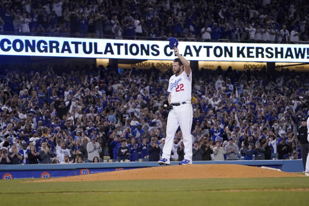 Dodgers pitcher Clayton Kershaw tips his cap after striking out Detroit's Spencer Torkelson.