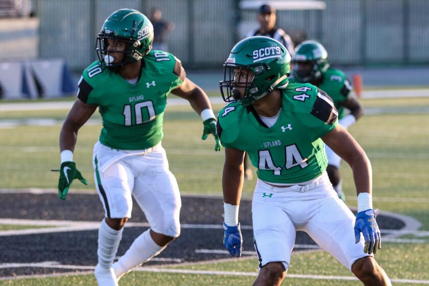 Justin Flowe (No. 10) and Jonathan Flowe (No. 44) await a snap against La Habra on Aug. 22, 2019.