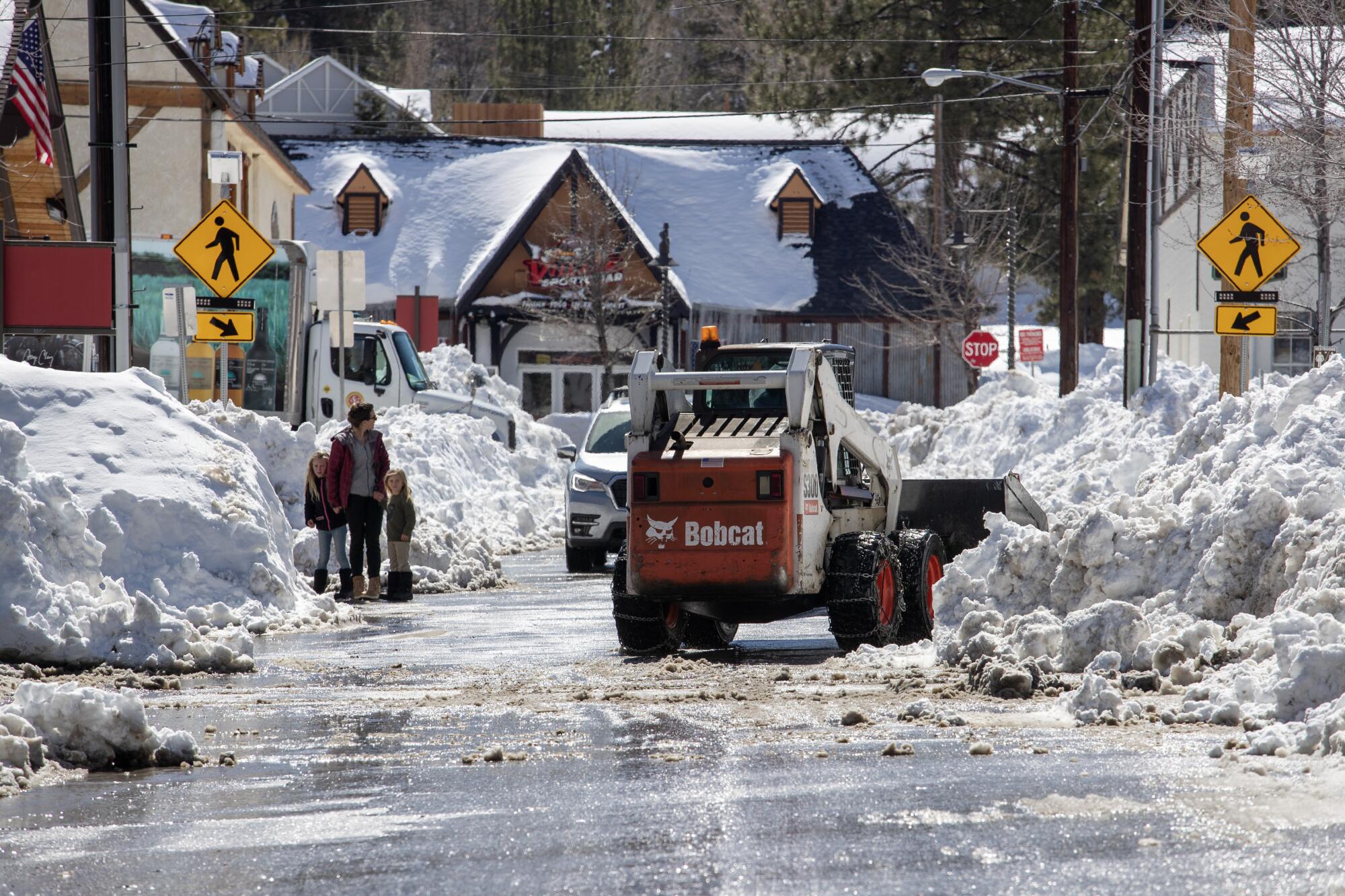 Big Bear Lake streets are plowed while the area is still choked with snow on Friday.