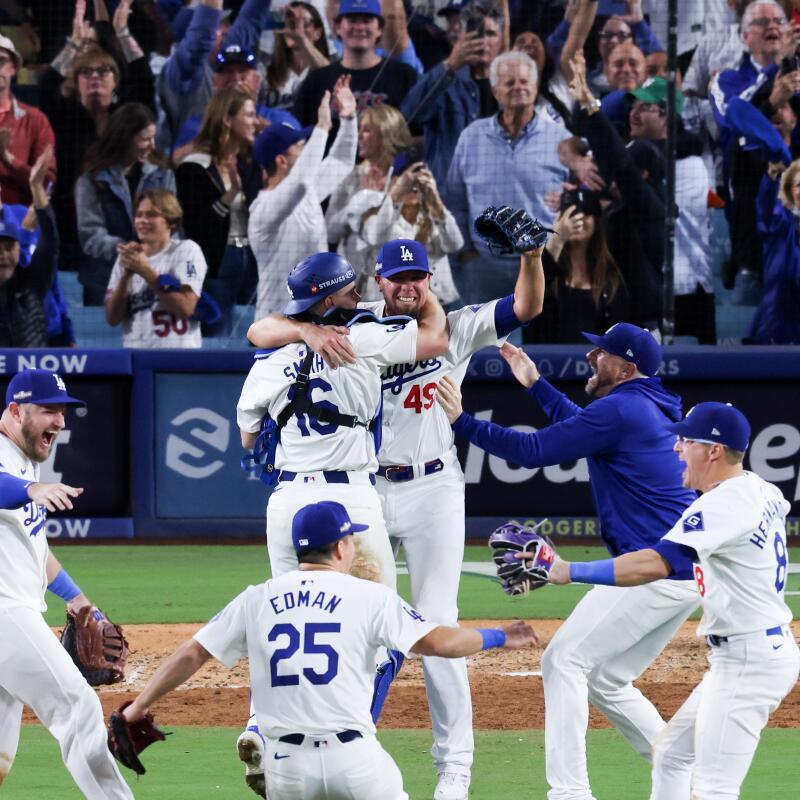 Dodgers players celebrate immediately after their NLCS Game 6 win over the Mets.