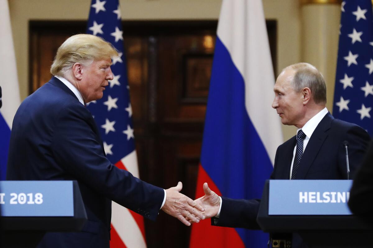 President Trump shakes hand with Russian President Vladimir Putin in Helsinki, Finland, on Monday.